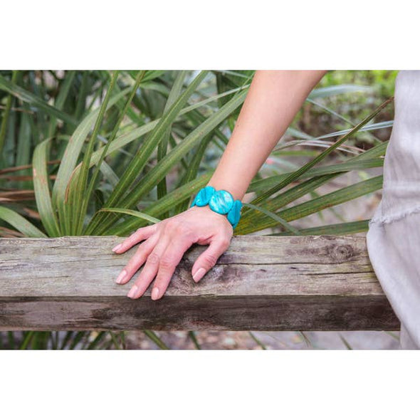 woman wearing turquoise bracelet