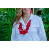woman wearing red lucia drop earrings and red multi-layer necklace